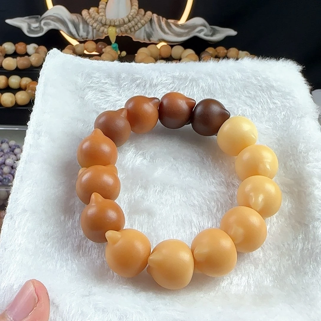 菩提根/象牙果手串工***队瑕疵卡18猫头手串一条