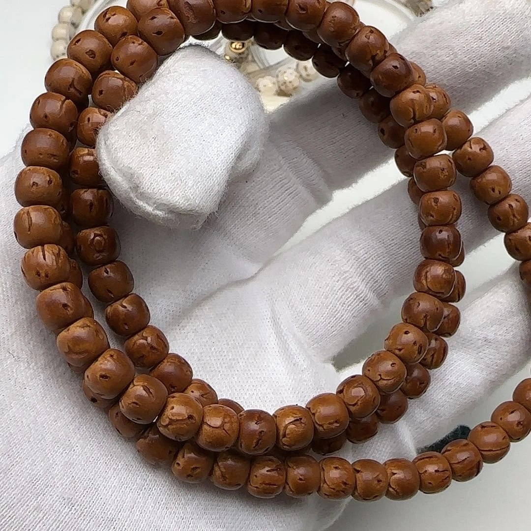 挽***梦桃核把件108直切手串