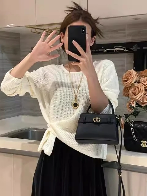 韩系设计感下摆提扣针织衫女秋季新款百搭简约休闲纯色毛衣女