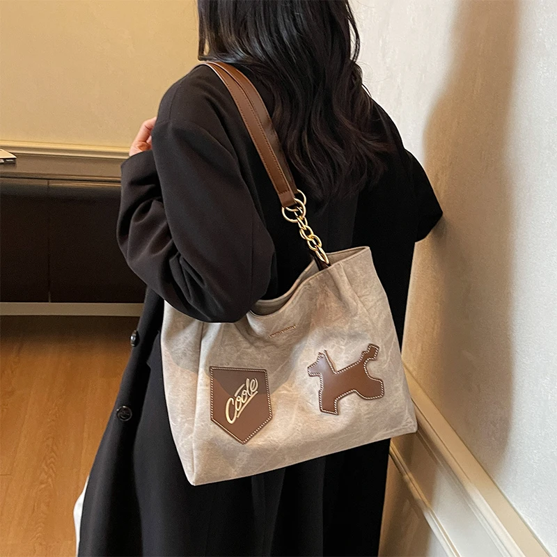 艾米兔女包2025新款潮流洋气简约拼接图案通勤单肩大容量托特包