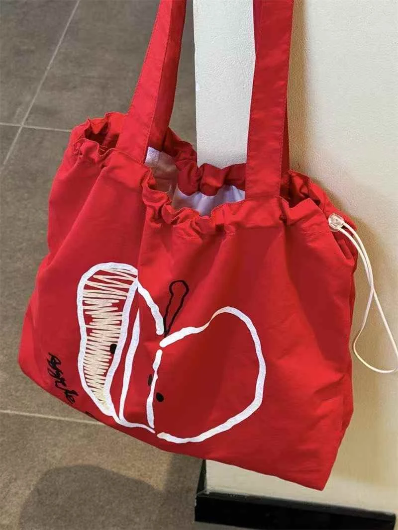 苹果新款抽绳帆布包学生轻便通勤百搭单肩包小众大容量简约托特包