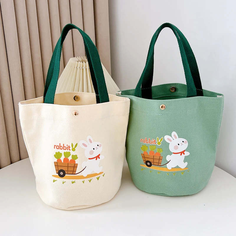 新款2025韩版撞色便携式休闲水桶手提包卡通小包学生上班族便当包