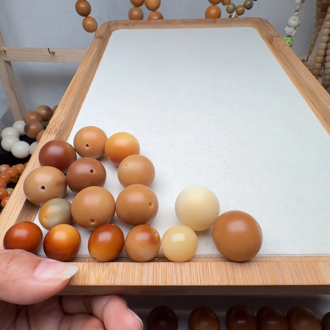鱼***间菩提根/象牙果手串干磨瑕疵散珠