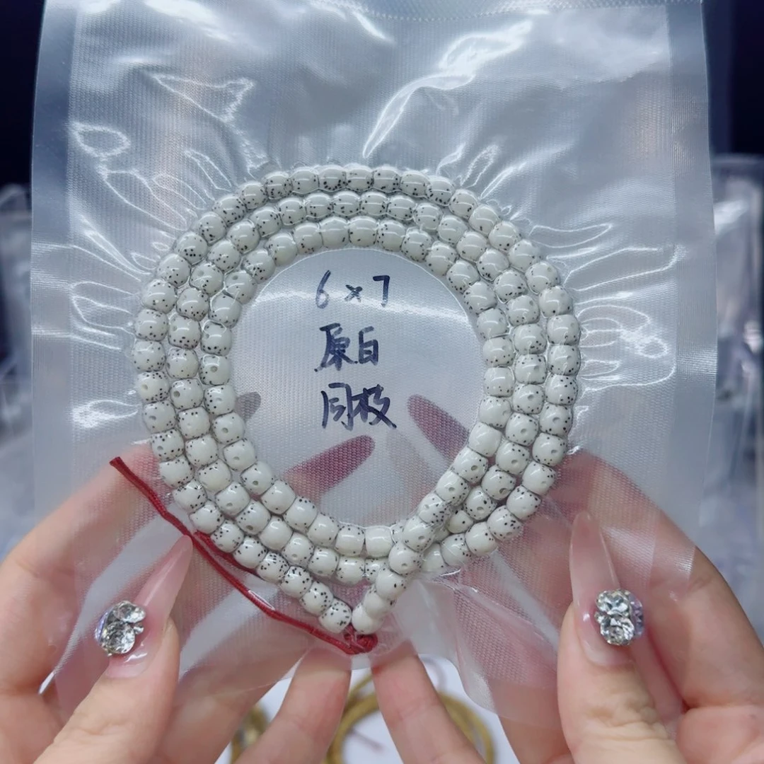 阿***.吊坠星月菩提7*6原白直切鼓珠