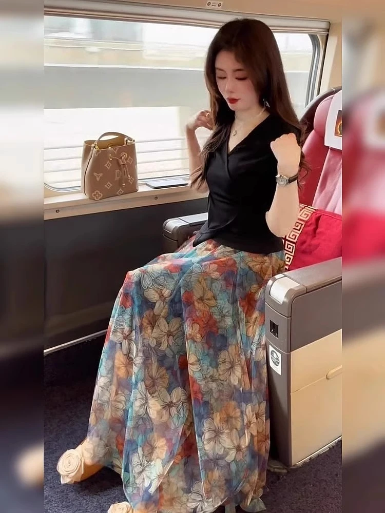 小个子绝美显瘦仙气飘飘印花a字长裙半身裙梨型身材遮胯2025新款