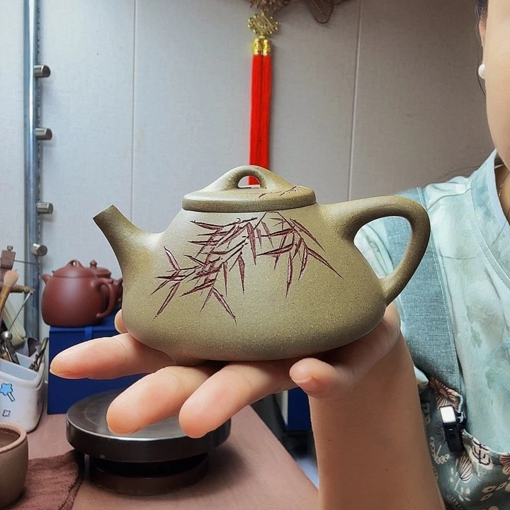 茶壶紫砂子冶石瓢半手，260毫升青段刻绘处理