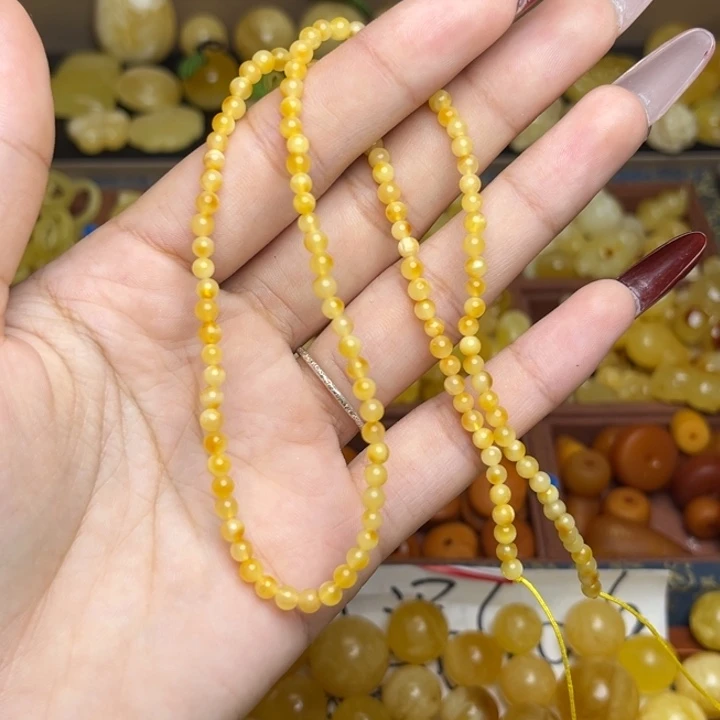 蜜蜡未镶嵌珠宝奇石鸡油黄妖花俏色小米珠链子