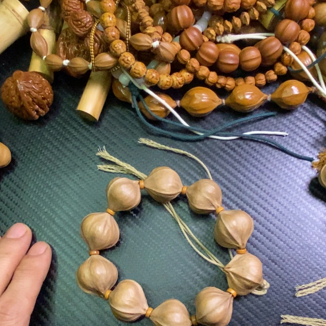 刁****竹类橄榄核素核四花手持