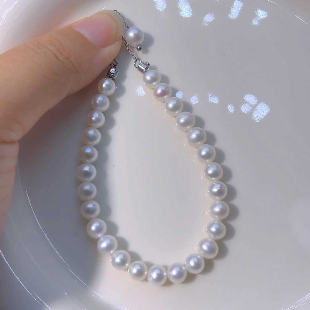 淡水珍珠5.5到6近圆丝绸光极光天然珍珠钛钢