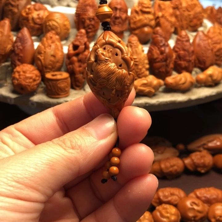 黎***明吊坠橄榄核橄榄核雕刻的单子