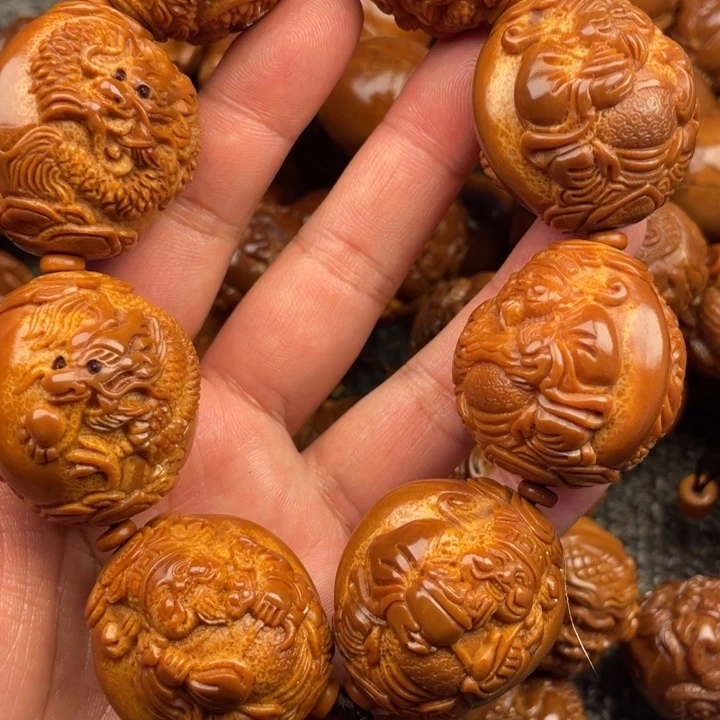 橄榄核吊坠乡**夫橄榄核手持