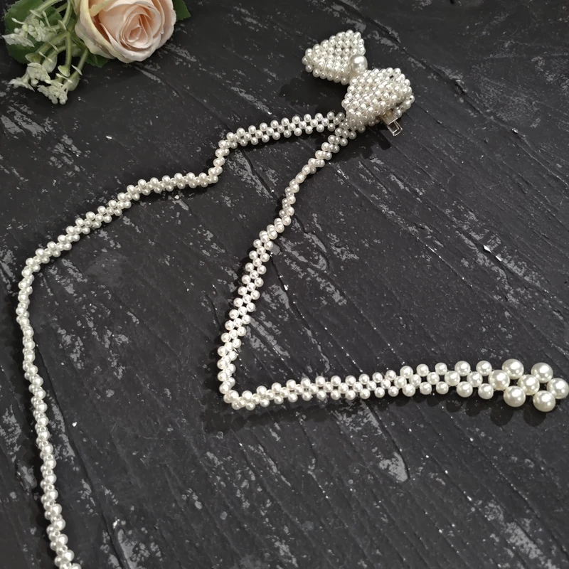 铜合金仿珍珠项链 05775时尚气质气质编织白珠珠蝴蝶结超长项链