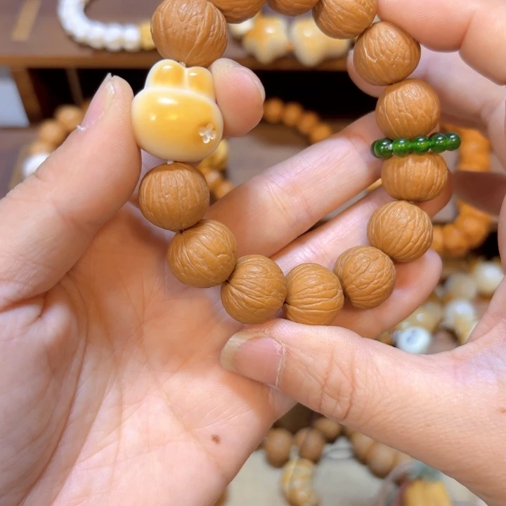 星月菩提手串猴头凤羽象牙果兔兔头