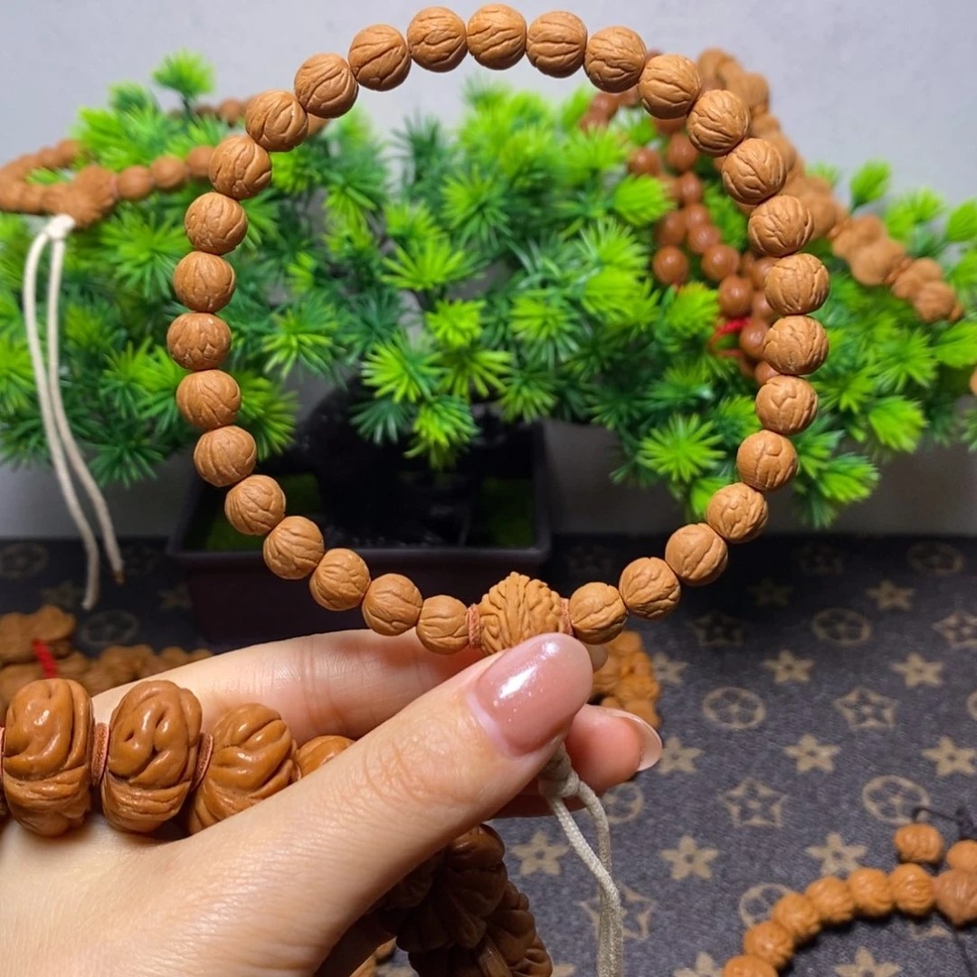 翟***勇手串桃核秦岭桃核