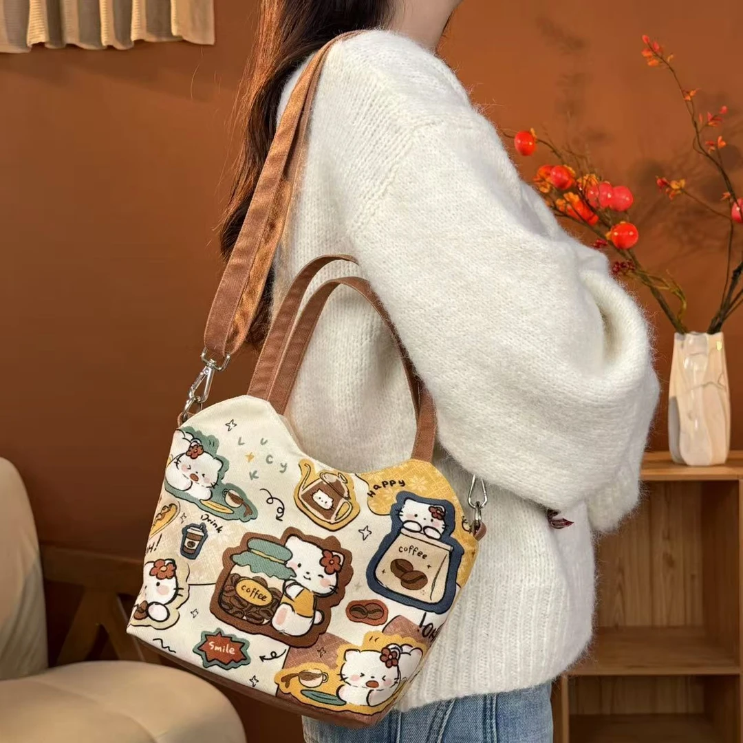 尼睿x劈叉的熊熊 新款原创可爱猫咪印花斜跨包大容量休闲水桶包