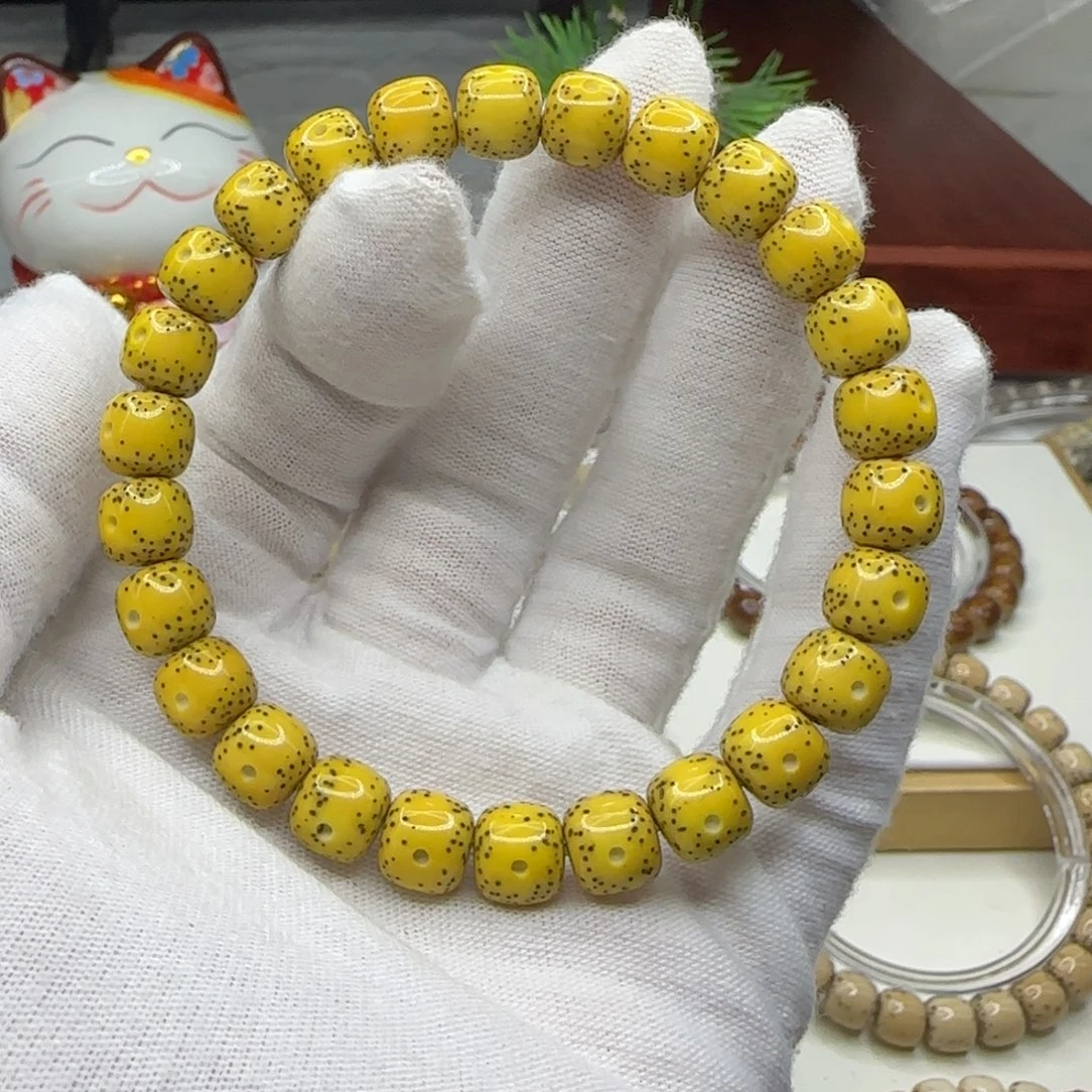 洋***少手串星月菩提鸡油黄通体留白8.5×7.5同枝果