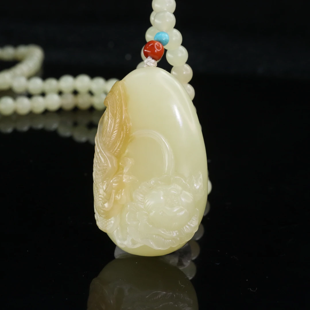 32和田玉且末金糖凤穿牡丹吊坠/900004上海嘉禾拍卖