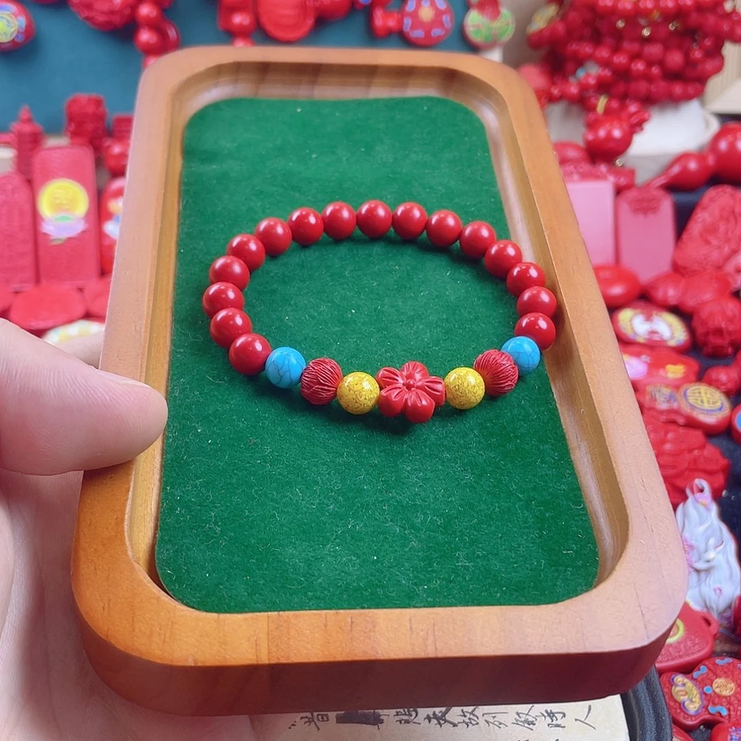 天然辰砂含辰砂工艺品有钱花手串