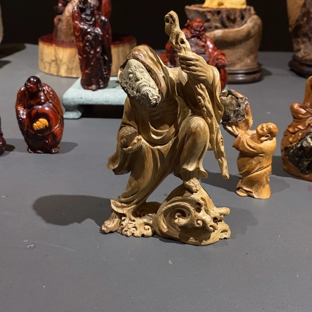 我***瘦金丝楠达摩根抱石金丝楠