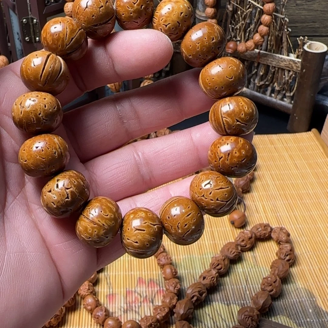 H***h脑纹桃核雕刻苹果园手串一物一图
