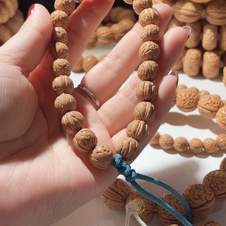 骆***骆桃核吊坠桃核手串野生13