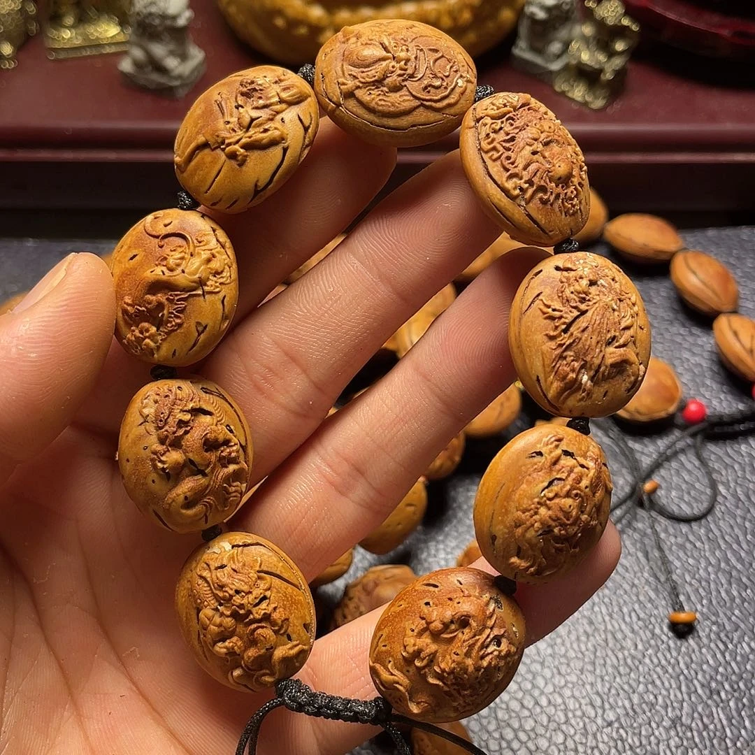大桃核雕刻瑕疵龙生九子