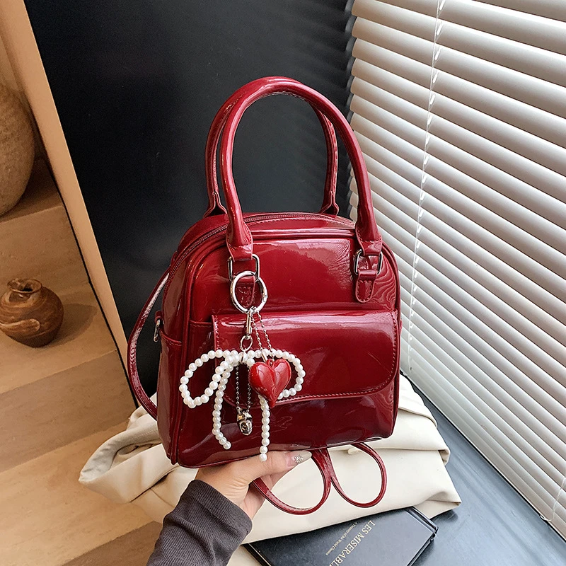 韩版高级感漆皮蝴蝶结迷你双肩背包2025新款复古手提小方包单肩包