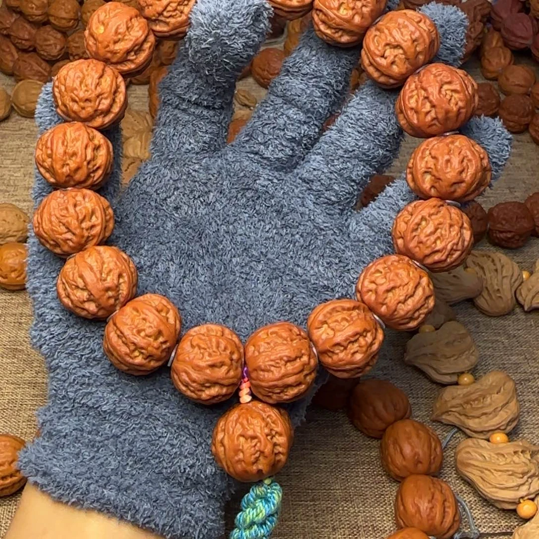 莫***尘吊坠文玩核桃珊瑚纹八棱磨盘手持