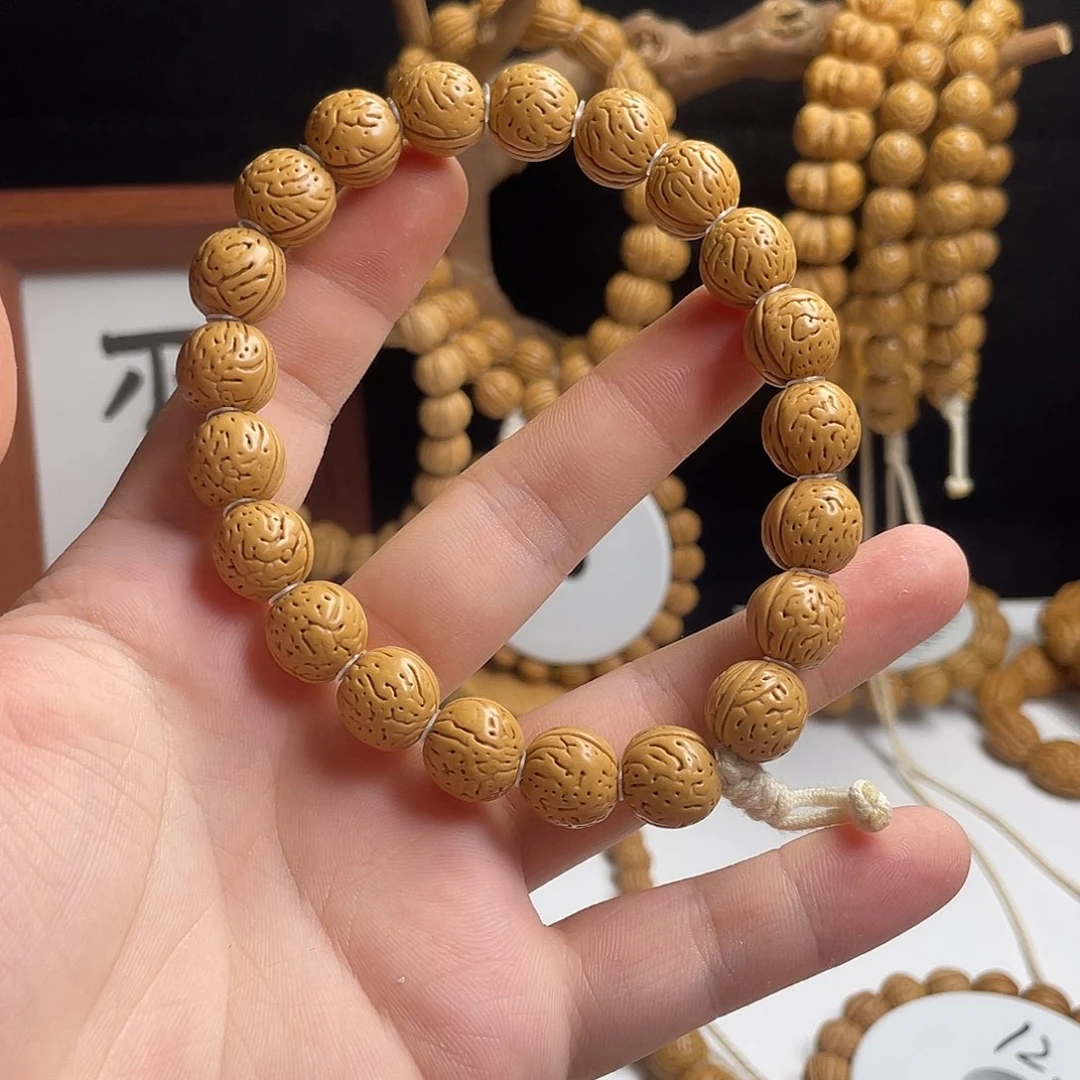 苏***～桃核手串12+密纹金豆