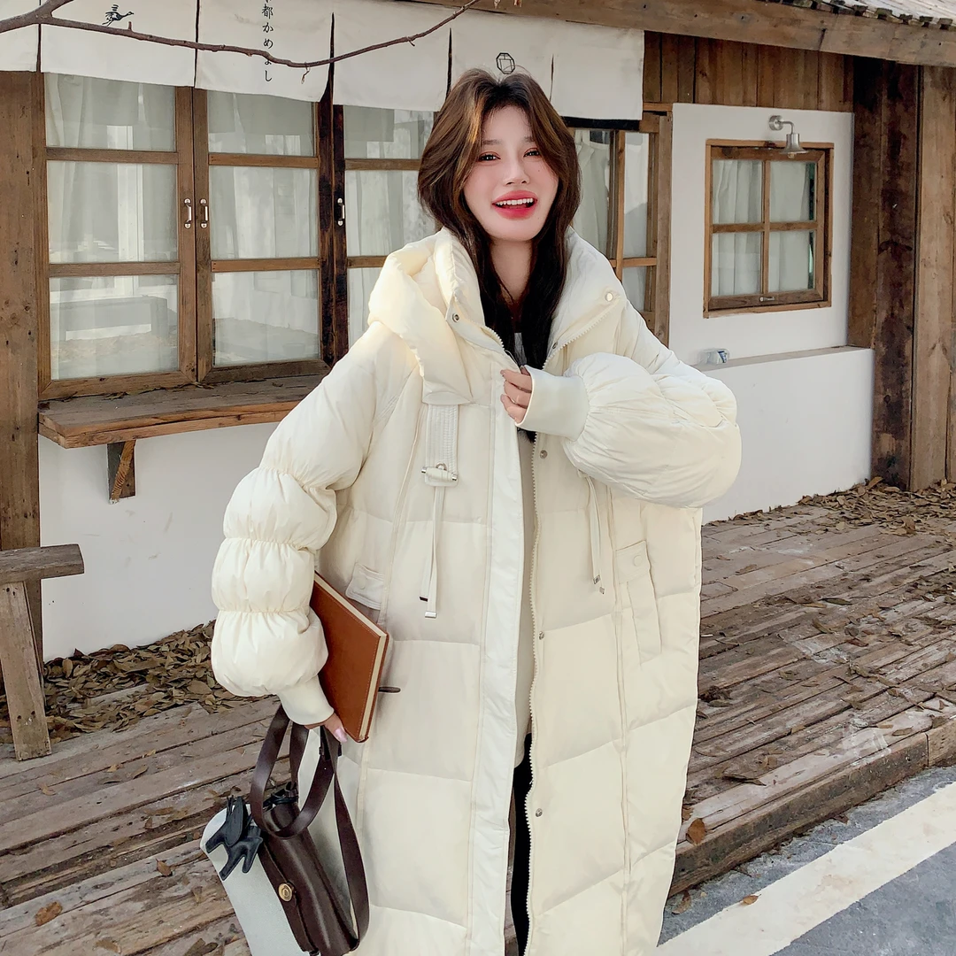 米白色长款连帽泡芙女冬季宽松韩版加厚保暖白鸭绒外套羽绒服2025