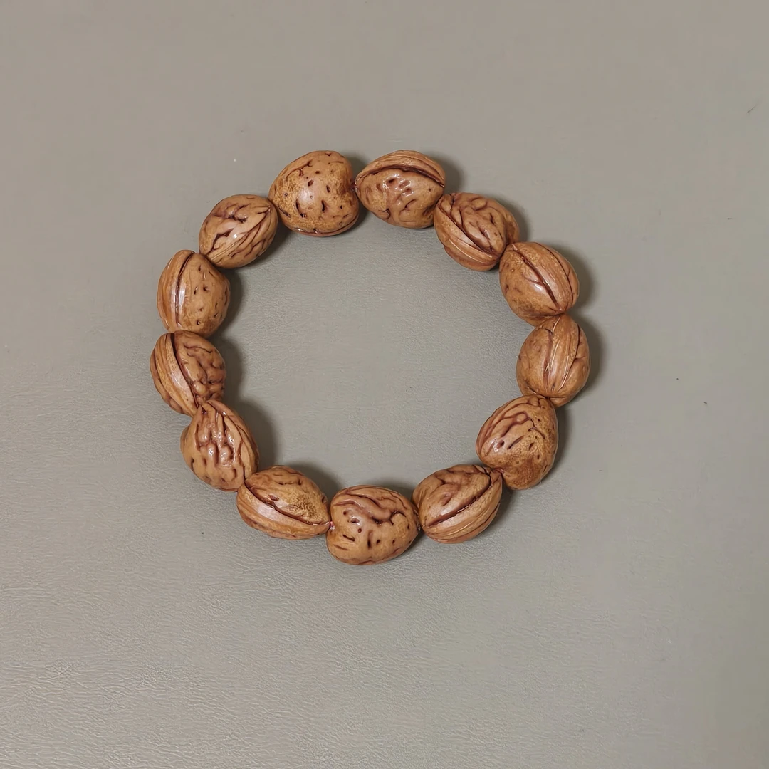 野生高山桃核纯手工打磨心形手串精品