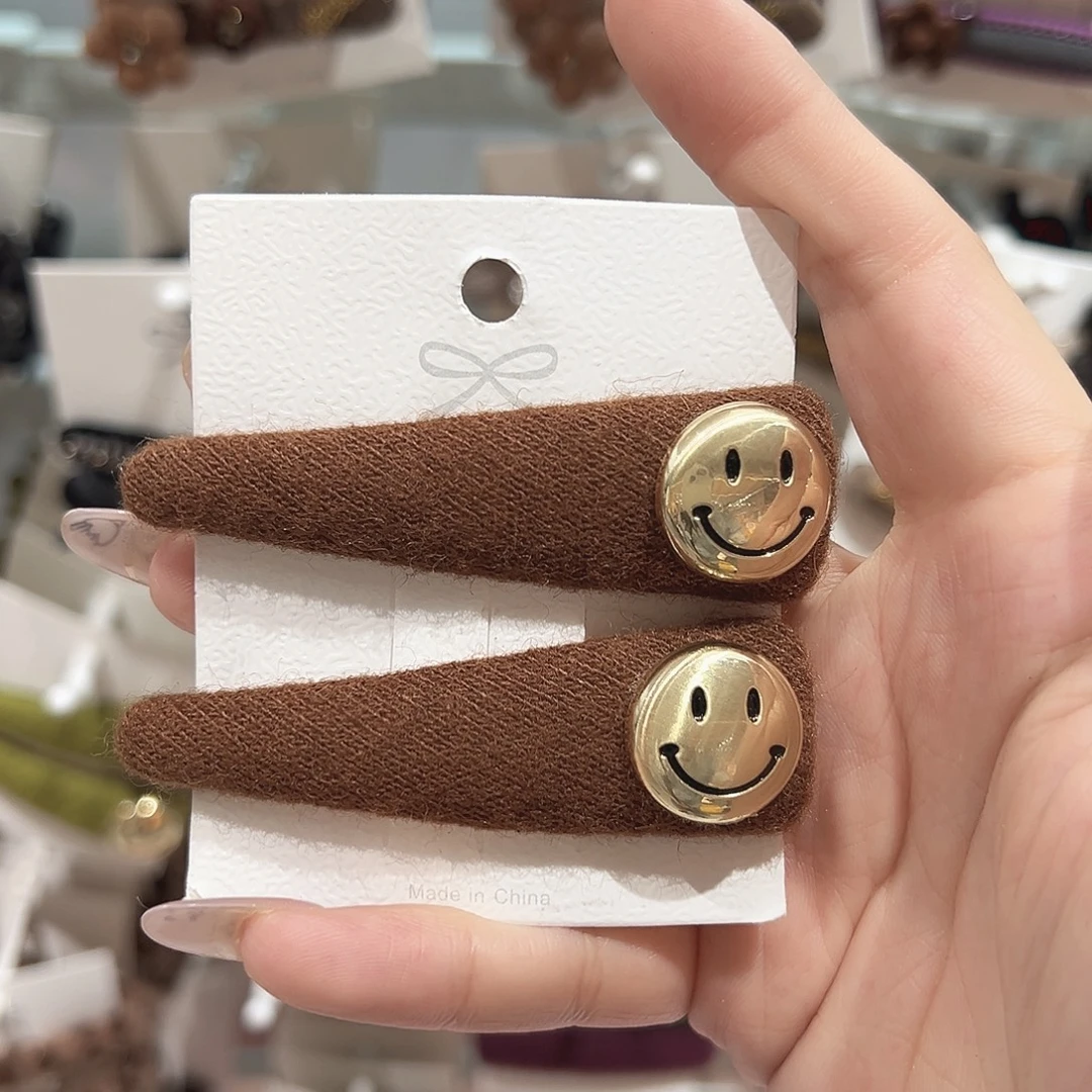 仿珍珠非金属笑脸咖色拜拜夹
