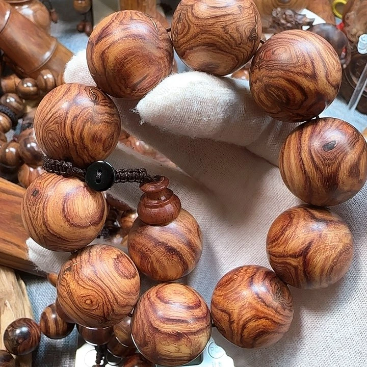 黄花梨/降香黄檀海黄对眼鬼脸纹手串