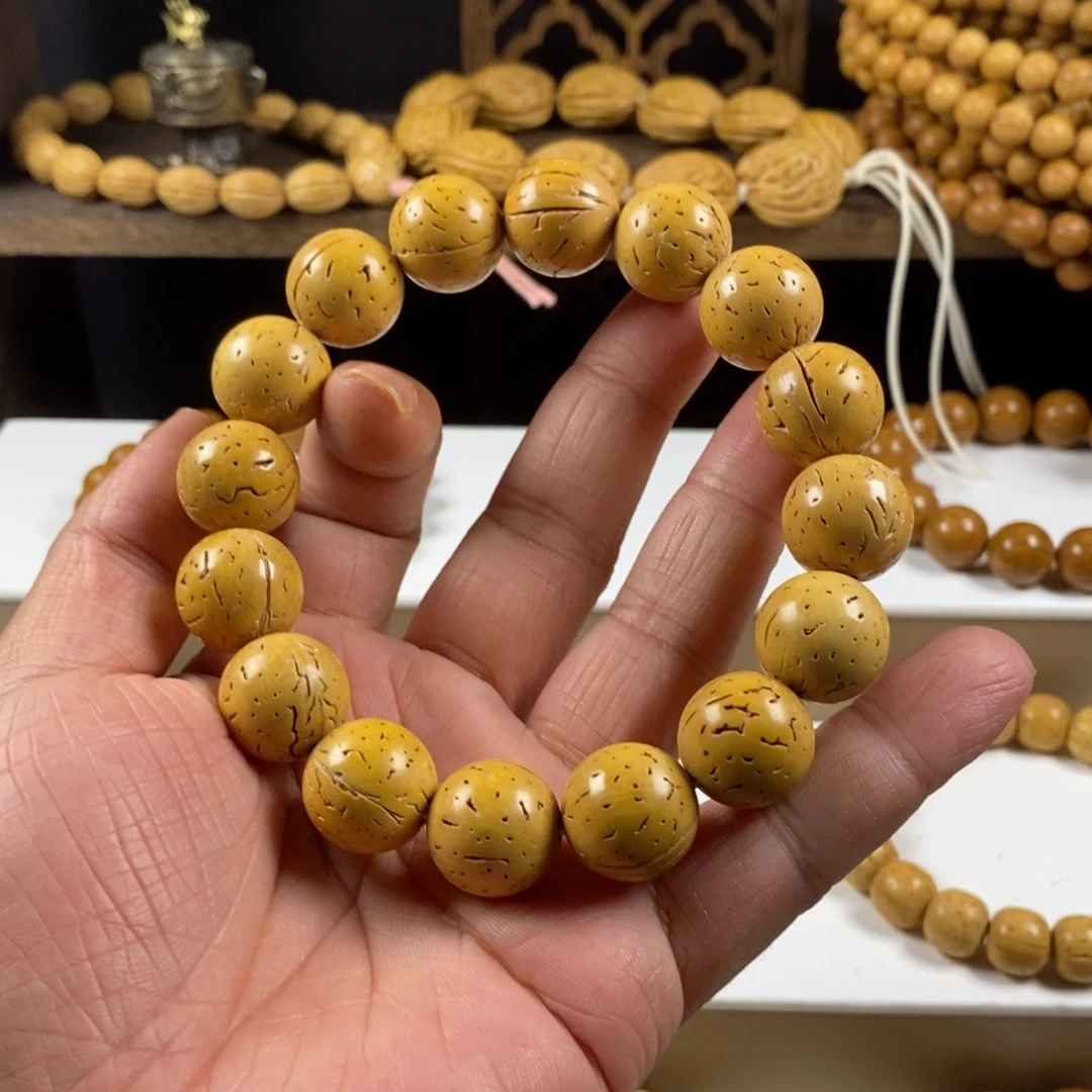 ****桃核吊坠盘锦奶油核正圆光珠