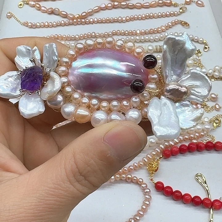 淡水珍珠耳饰银S925镶嵌霍****?