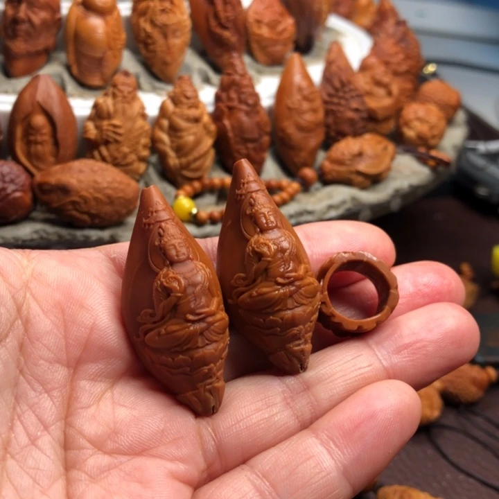 冷****橄榄核吊坠橄榄核雕刻手把件