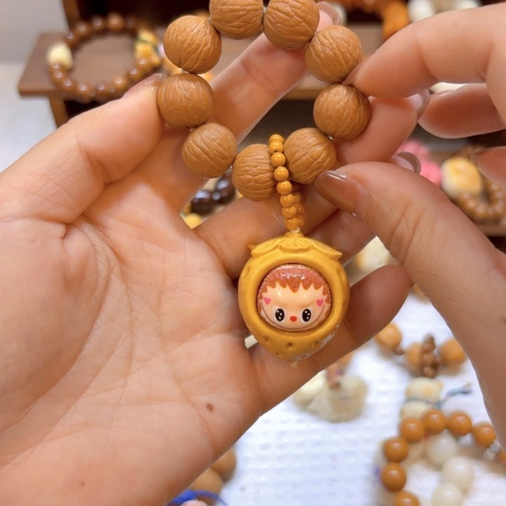 星月菩提手串猴头全品凤羽手捻草莓拉布布