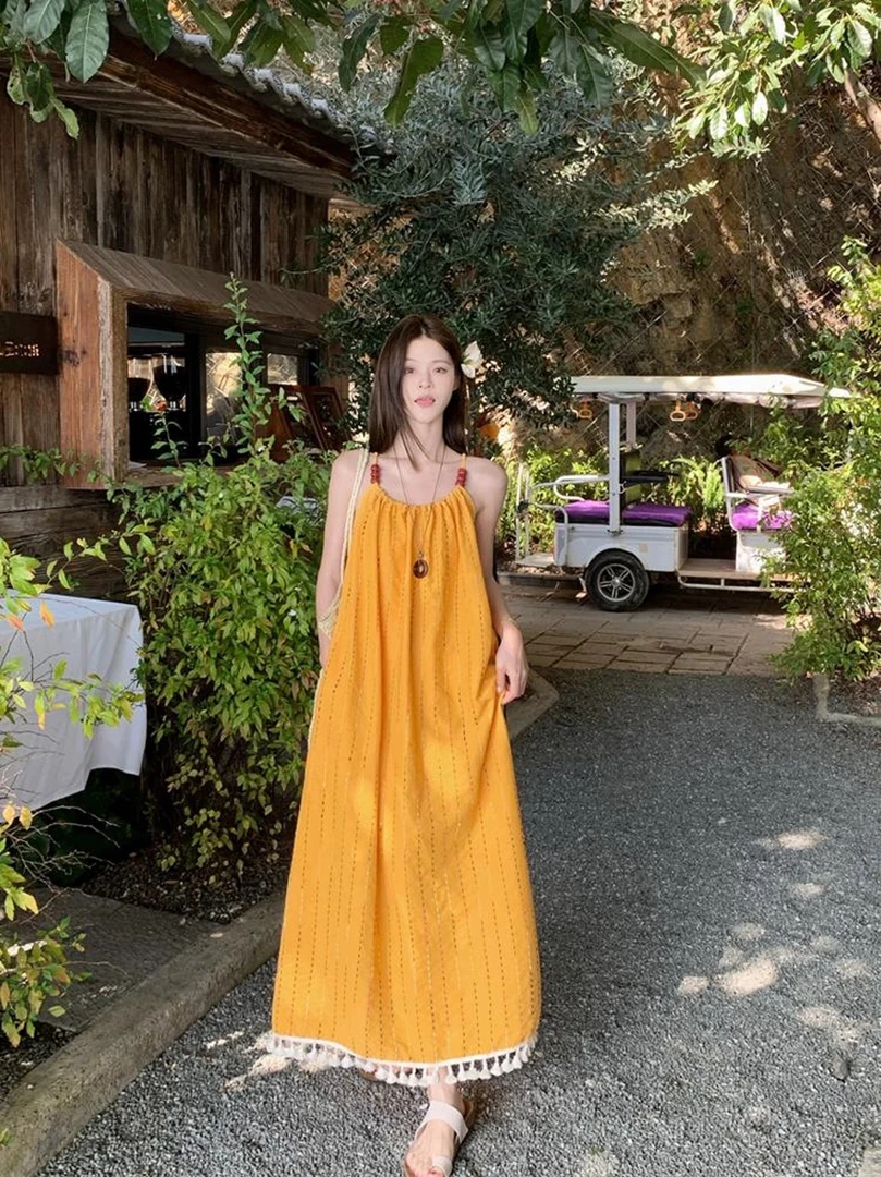 黄色流苏吊带连衣裙女夏高级感超好看海边度假气质长裙