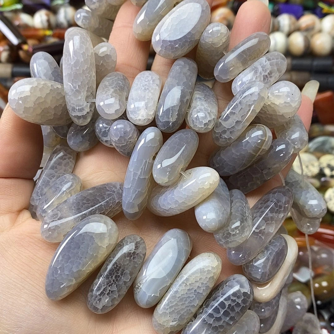 玛瑙/玉髓未镶嵌珠宝半成品玛瑙牙牙一条