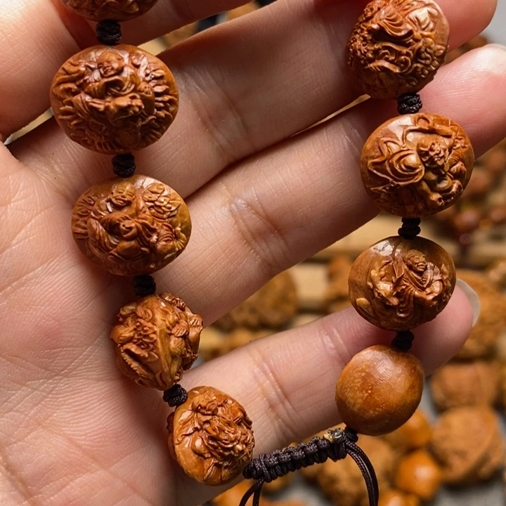 恒***桃核手工雕刻骑兽十八罗汉手串