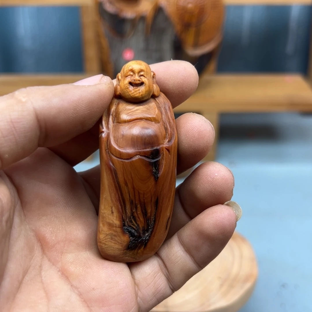 旭***》木崖柏木摆件手把件