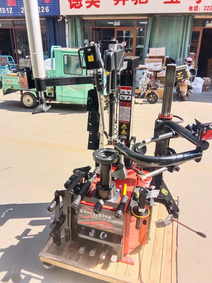 轮胎扒胎机营口佰仕泓博品牌无盘翻转鸟头带举升小车双附助臂