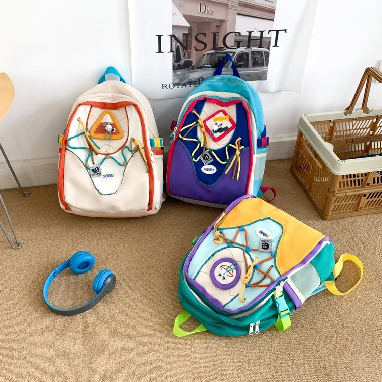书包潮流个性百搭初中大学生时尚轻便撞色卡通双肩背印花休闲书包
