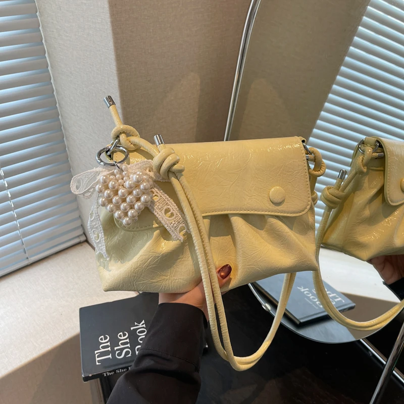 夏季多巴胺手提包包女2025新款时尚褶皱百搭单肩包通勤斜挎包