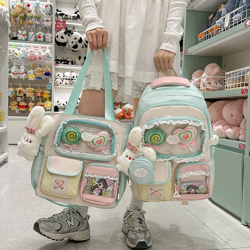 书包女生2025新款高颜值吧唧痛包小学初中生轻便双肩包高中大学生