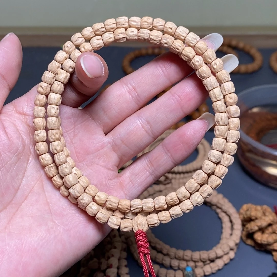 柏香籽/百香籽吊坠大*6毫米左右粉皮鬼脸