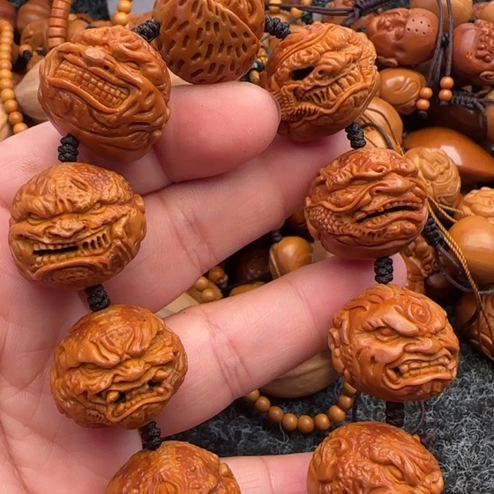 橄榄核手串目****事橄榄核雕工艺手串