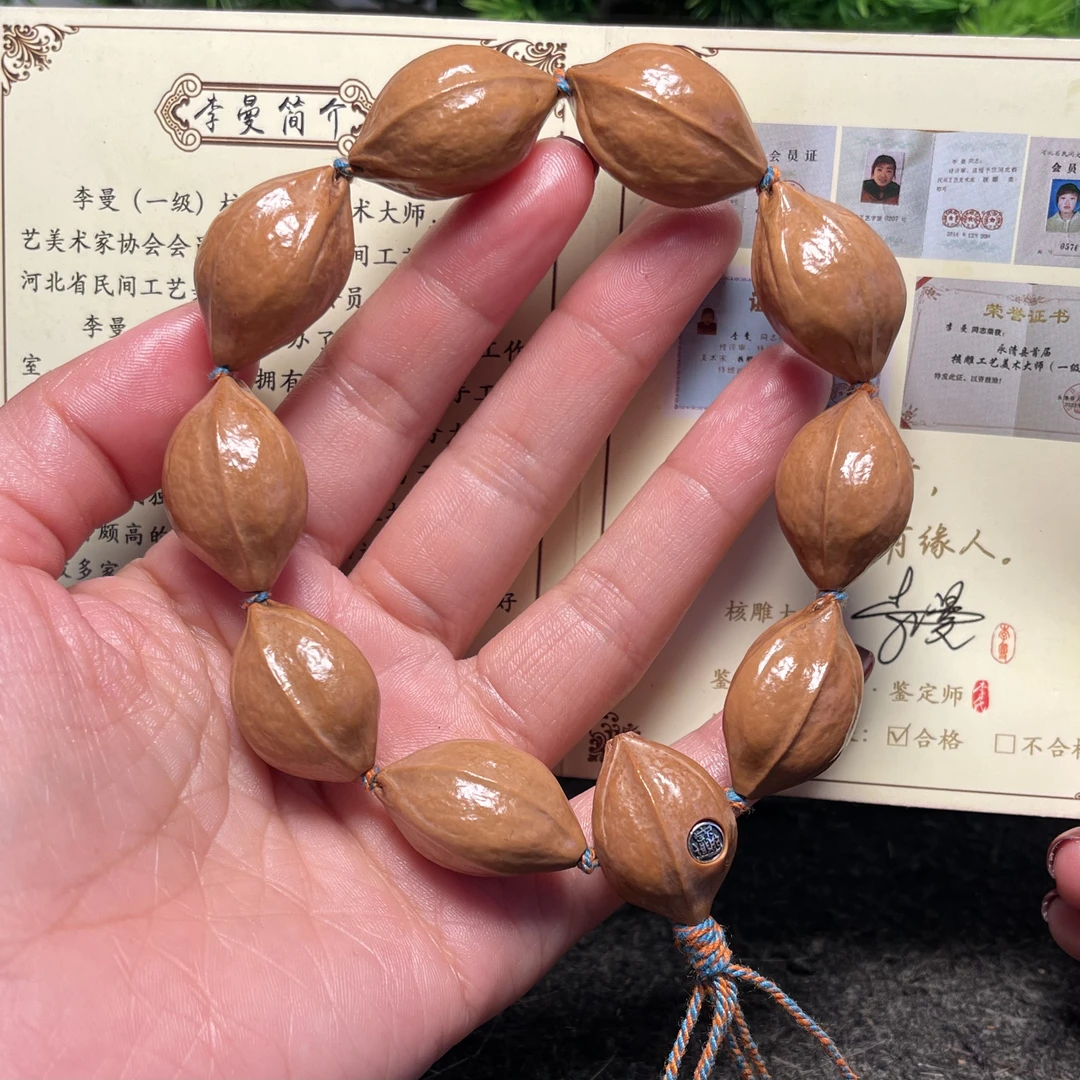 三面佛铁素镶嵌招财进宝橄榄核铁核素核原皮素串橄榄核雕刻文玩