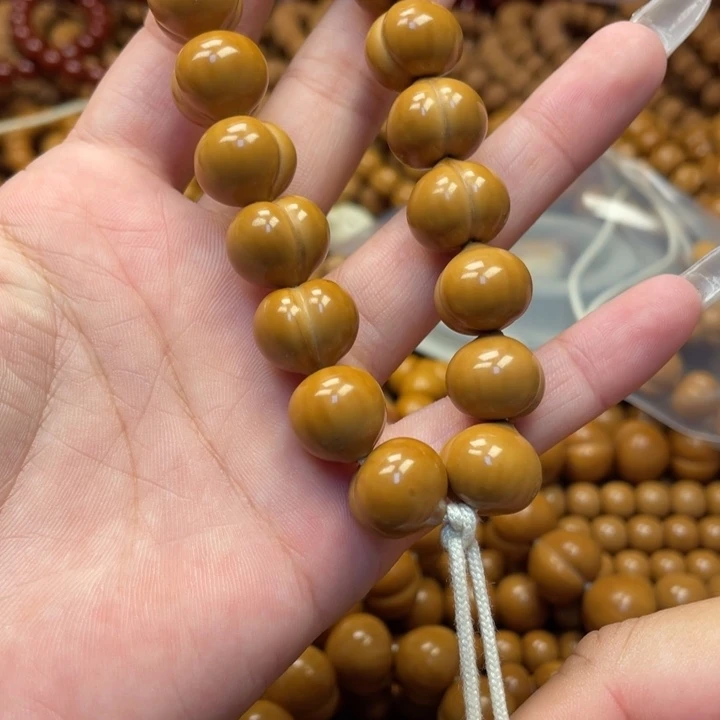 余***心核桃微瑕亮面屁桃手持