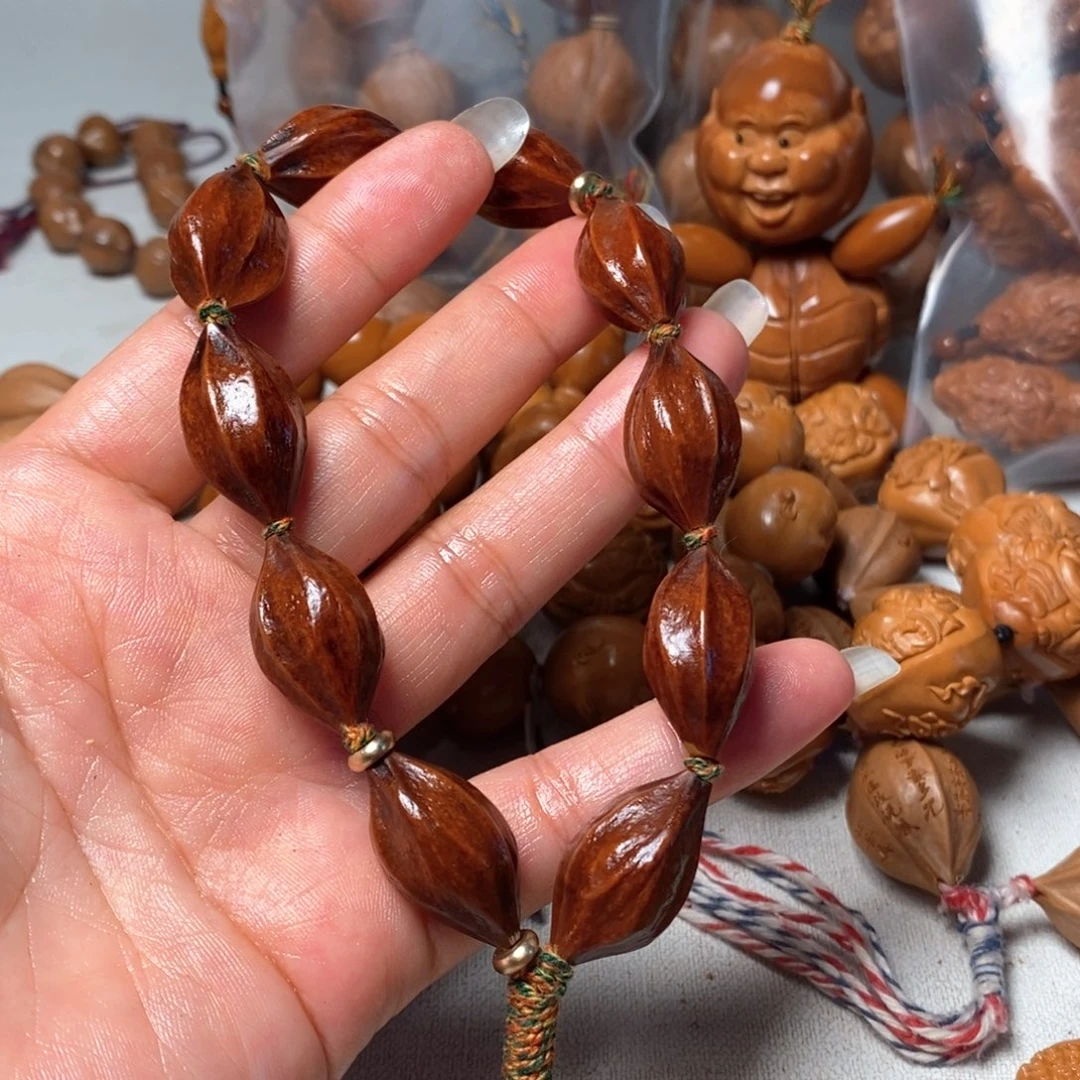 牛***宇橄榄核吊坠紫皮素核
